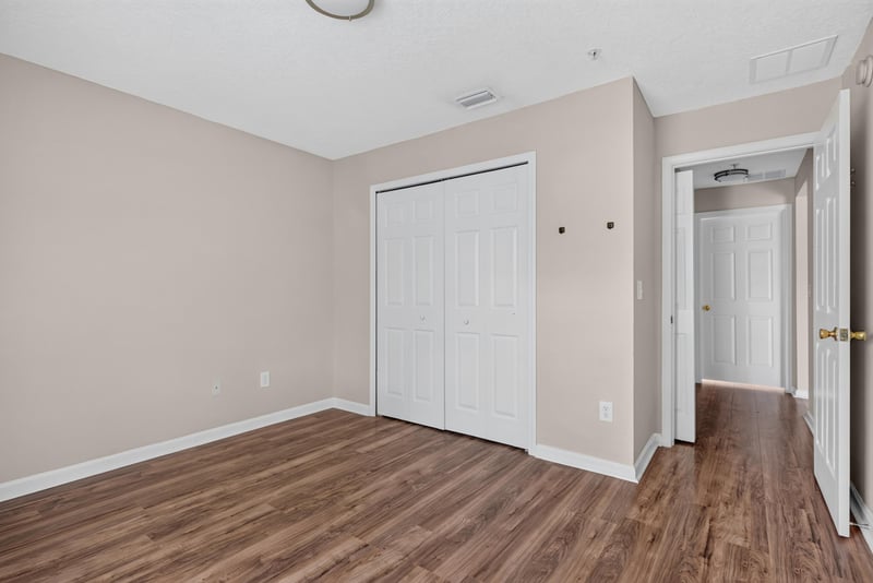 Bedroom with closet and hallway doorway at 7047 Deer Lodge Cir, Jacksonville