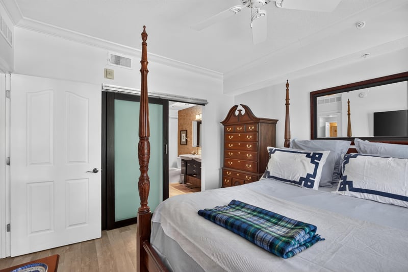 Primary bedroom with plantation shutters at 10435 Mid Town Pkwy unit 135, Jacksonville, FL 32246