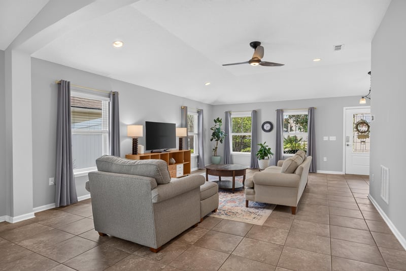 Living room view toward front entry and windows at 85 Amia Dr, St. Augustine, FL 32086