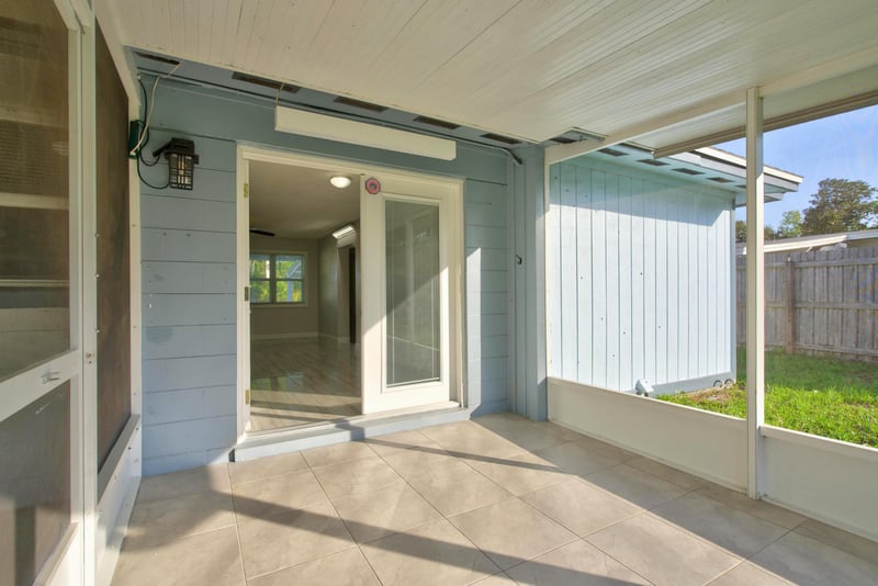 Screened porch with French door entry at 442 Ameca Ave, Orange Park, FL 32073