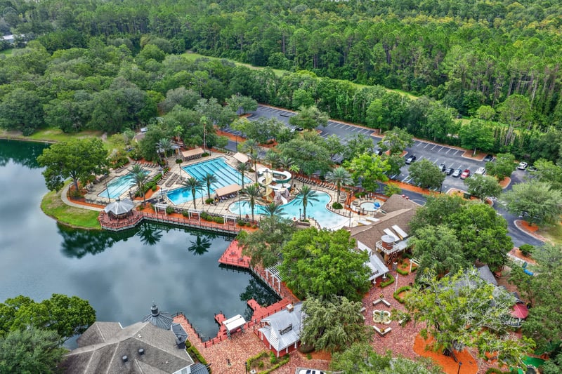 Aerial view of community pool along the lake in Oakleaf Plantation