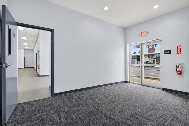 Doorway view into hallway toward storefront entrance at 7240 Golden Wings Rd building 100, Jacksonville, FL 32244