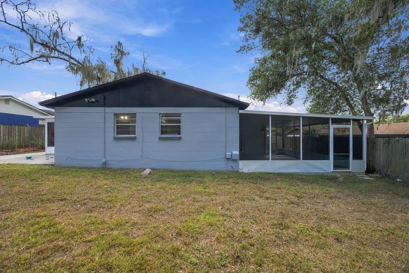 Back exterior with screened porch at 417 Capricorn Ln, Orange Park, FL 32073