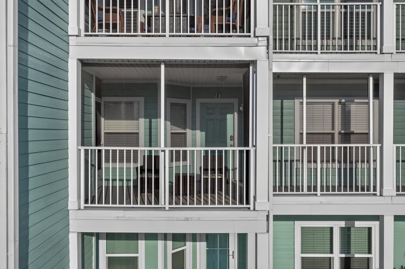 Close view of a screened balcony on the building exterior at 206 16th St, St. Augustine, FL 32080