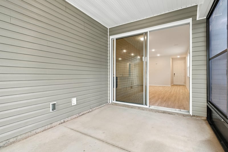 Empty screened porch with screen enclosure at 7088 Mahogany Run Dr, Jacksonville, FL 32244