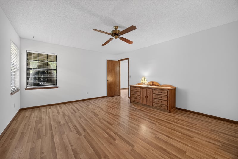 Empty room with wood floor and dresser at 2460 San Sago Ln, Jacksonville, FL