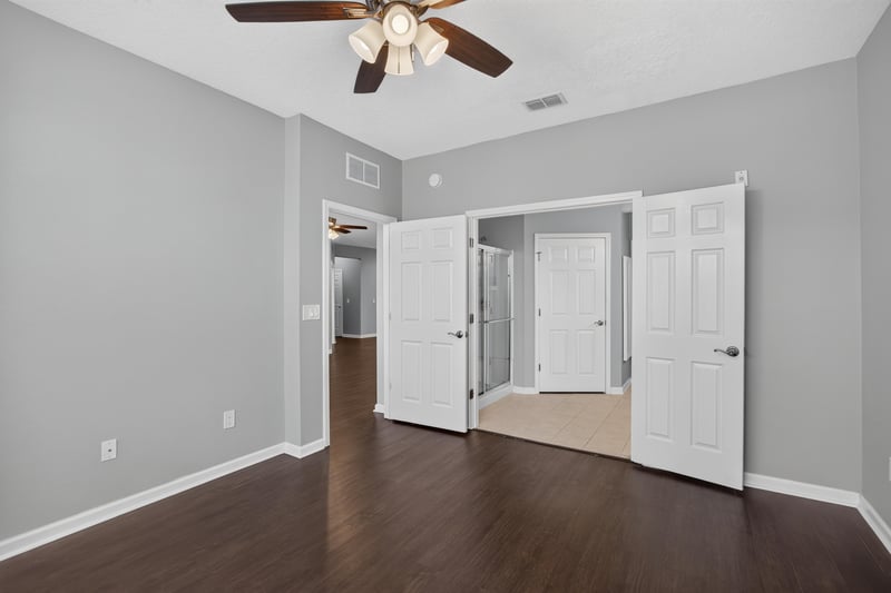 Bedroom with two doors to closet and bath at 11251 Campfield Dr unit 4209, Jacksonville, FL 32256
