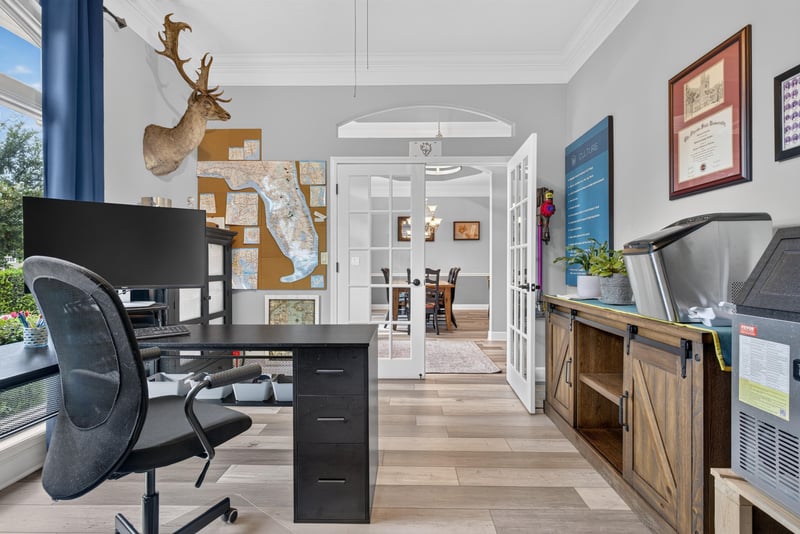 Home office with desk and French doors at 2304 Spring Hill Ct, Orange Park, FL