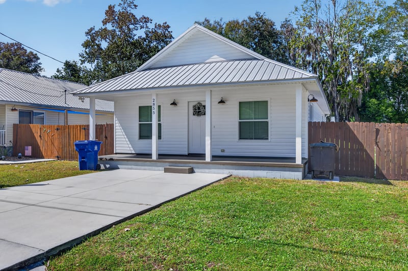Front exterior angled view with driveway and fencing at 2855 N 8th St, St. Augustine, FL 32084
