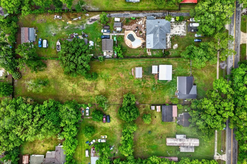 Aerial daytime view of the home and wooded lot in Jacksonville, FL