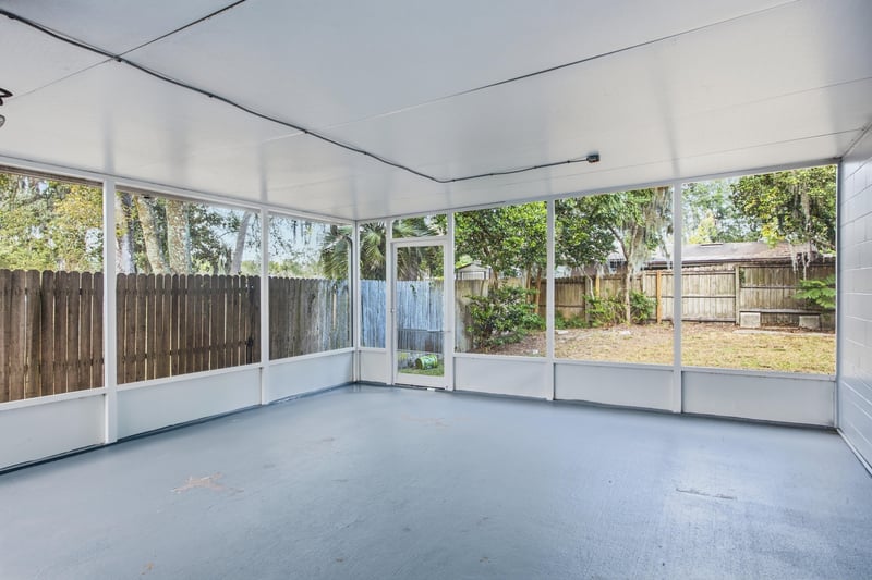 Screened back porch with windows at 417 Capricorn Ln, Orange Park, FL 32073
