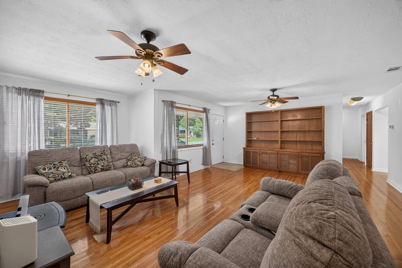 Living room with sectional sofa and windows at 1847 Grove Park Dr, Orange Park, FL