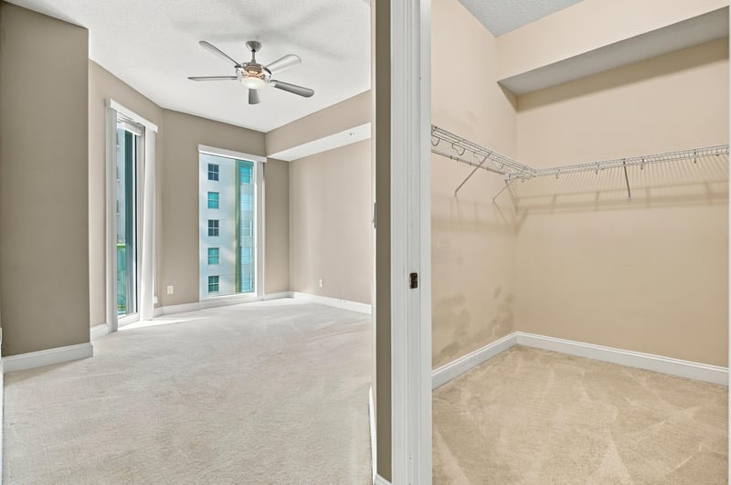 Bedroom with windows and walk-in closet, photographed by Megapixeler on Riverplace Blvd, Jacksonville