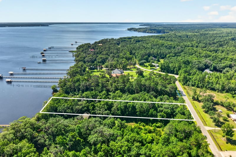 Wide aerial view of the river and parcel boundaries at 110 River Shores Rd, Palatka, FL 32043