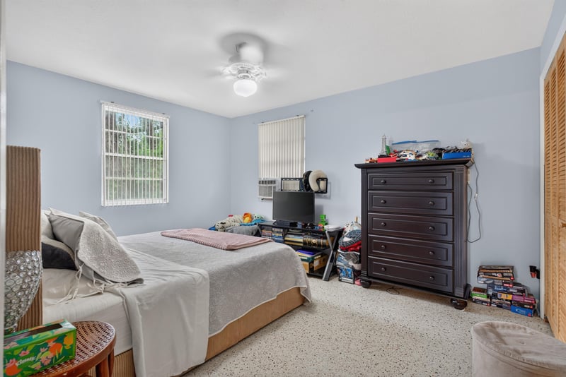 Bedroom with dresser and bed at 5745 110th St, Jacksonville, FL 32244