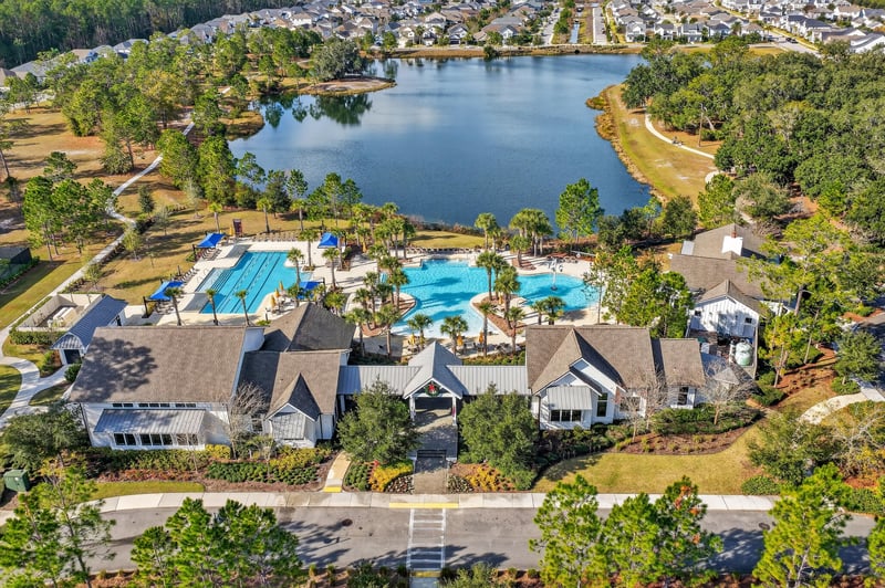 Aerial view of the community pool and lake in Whisper Creek