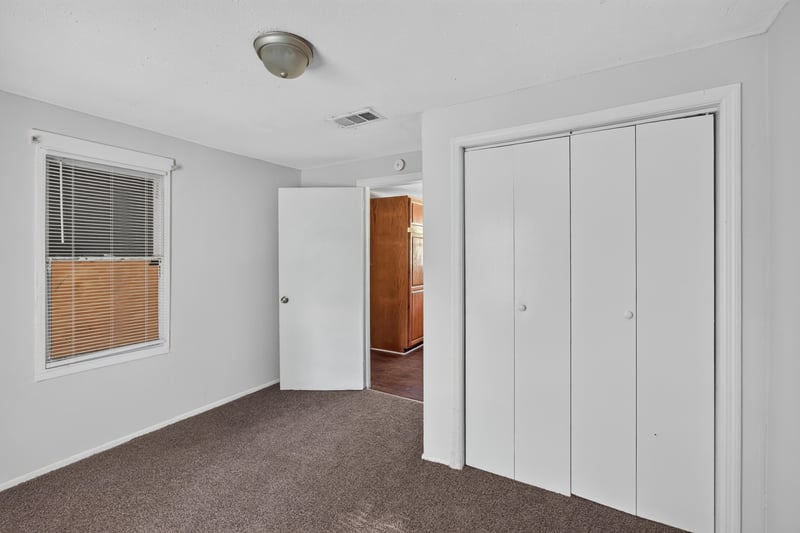 Bedroom with carpet and double closet doors at 2372 2nd Ave, Jacksonville, FL 32208