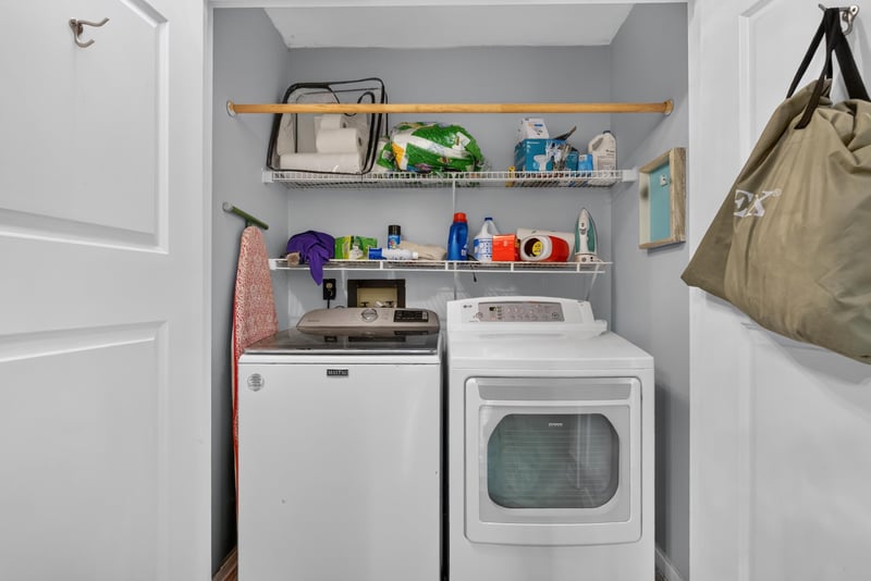 Laundry room with shelving and washer dryer at 8680 Bandera Cir S, Jacksonville, FL 32244