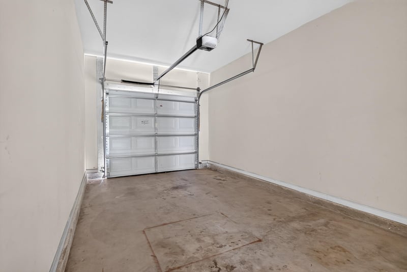 Attached garage with roll-up door at 12359 Mangrove Forest Ct, Jacksonville, FL 32218