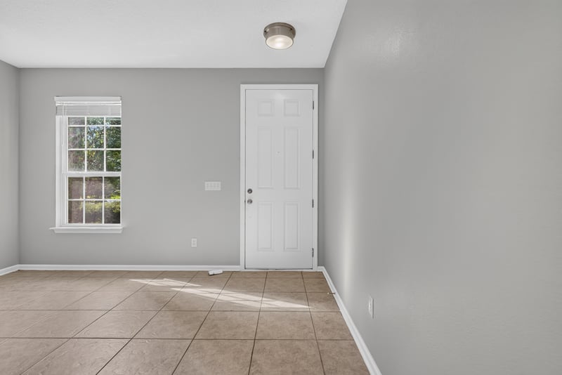 Empty front room with window and tile floor at 13685 Goodson Pl, Jacksonville, FL 32226