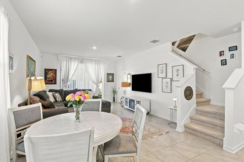 Living and dining area with round table at 8359 Zenith Cir, Jacksonville, FL 32256