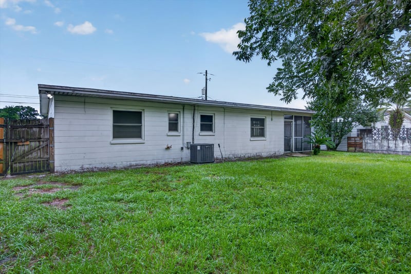 Rear exterior with fenced lawn at 11462 Elane Dr, Jacksonville, FL