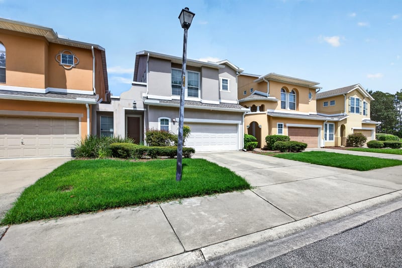 Front exterior with paved driveway and entry at 6217 Eclipse Cir, Jacksonville, FL 32258