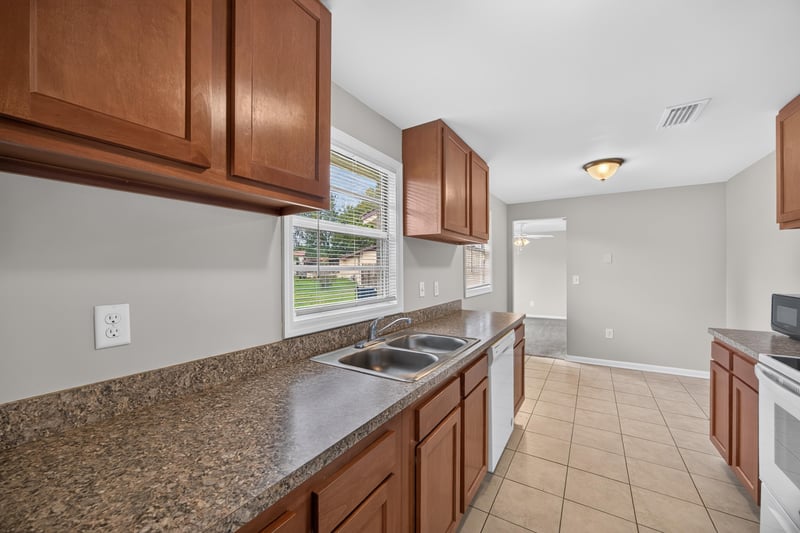 Kitchen counter and cabinets with tile floor at 1143 Tumbleweed Dr, Orange Park, FL 32065