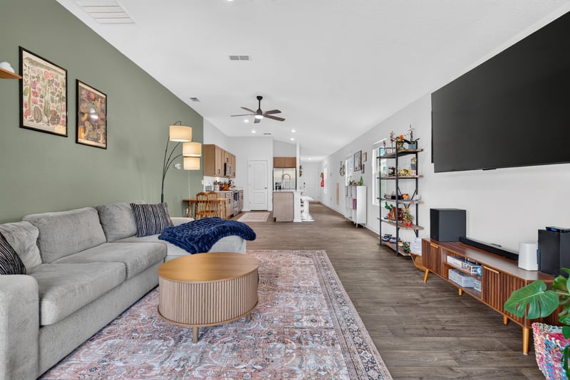 Open living and dining area toward kitchen at 4276 Quaking St, Jacksonville, FL 32218