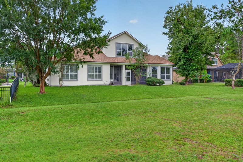 Side yard with mature trees at 4109 Eagle Landing Pkwy, Orange Park, FL 32065
