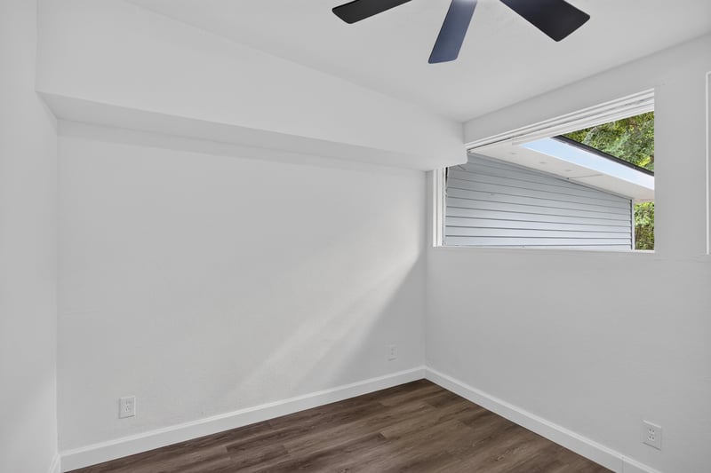 Bedroom with angled window and ceiling fan at 3113 Kline Rd, Jacksonville, FL 32246