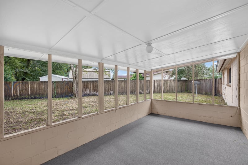 Screened porch with concrete flooring at 1435 Undine Ave, Jacksonville, FL