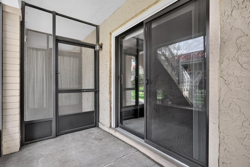 Screened porch with sliding glass door at 5811 Atlantic Blvd unit 47, Jacksonville, FL 32207