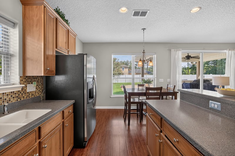 Kitchen sink area with view into the dining space at 3660 Middlebrook Dr, Orange Park, FL 32065