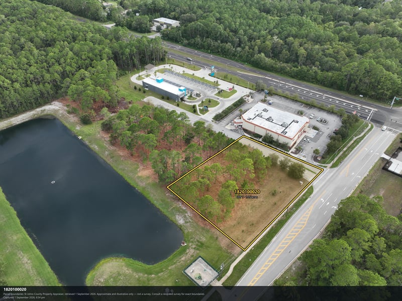 Aerial view of the pond and tree-covered parcel at 4900 US-1, St. Augustine, FL 32086