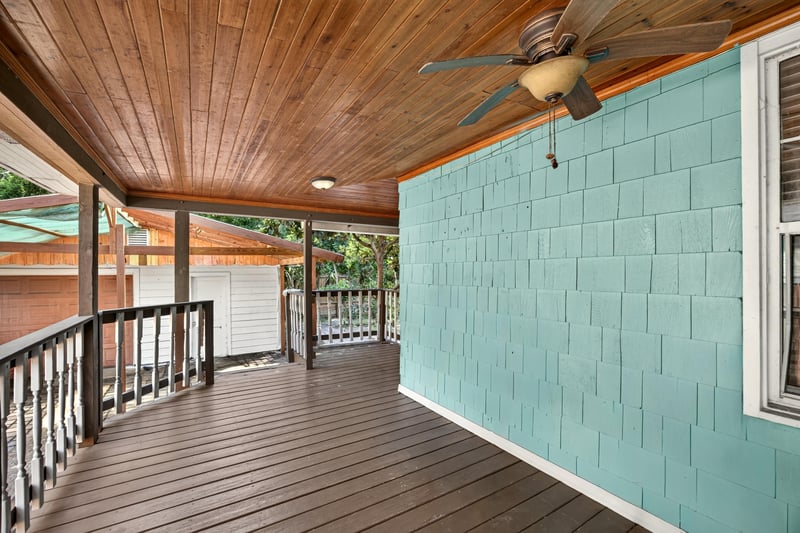Covered back porch with teal exterior wall and wood ceiling at 2841 Ernest St, Jacksonville, FL 32205