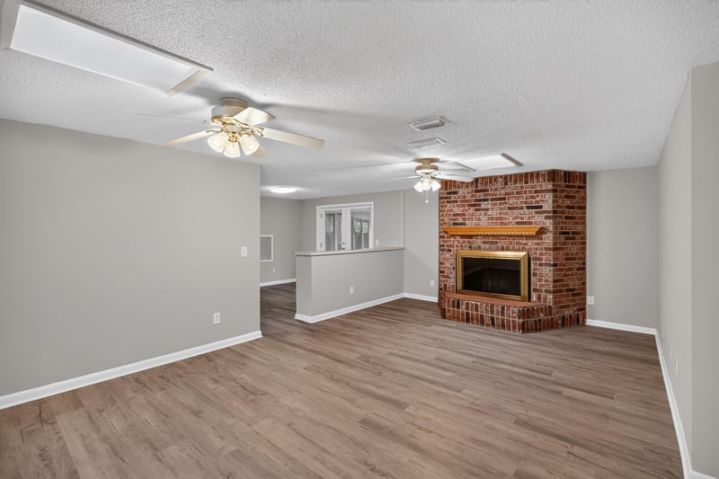 Living room with wood-look floors and ceiling fan at 1435 Undine Ave, Jacksonville, FL