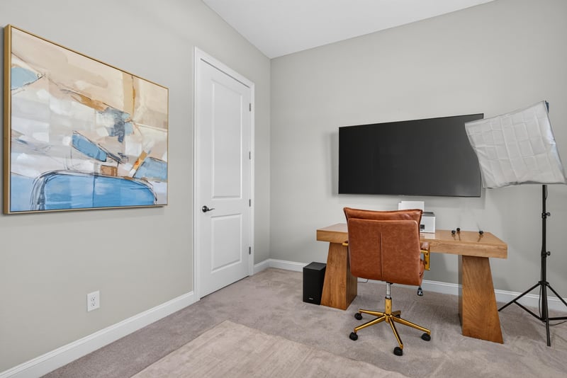 Home office desk with wall art at 3328 Southern Oaks Dr, Green Cove Springs, FL 32043