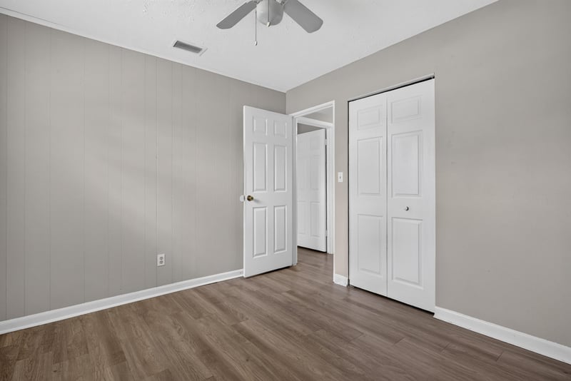 Bedroom with ceiling fan and window at 255 Woodside Dr, Orange Park, FL 32073