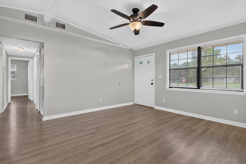 Living room with ceiling fan and windows at 255 Woodside Dr, Orange Park, FL 32073