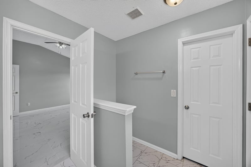Hallway with doors to bedroom and bath at 490 Hillside Dr, Orange Park, FL 32073