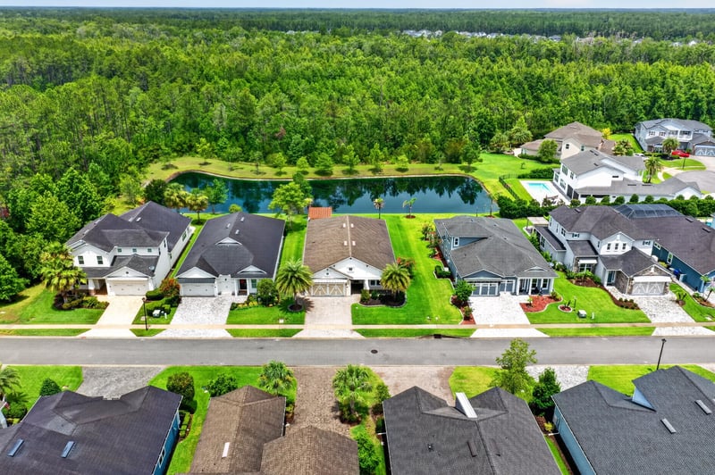 Aerial row of homes along a pond in St. Johns, FL