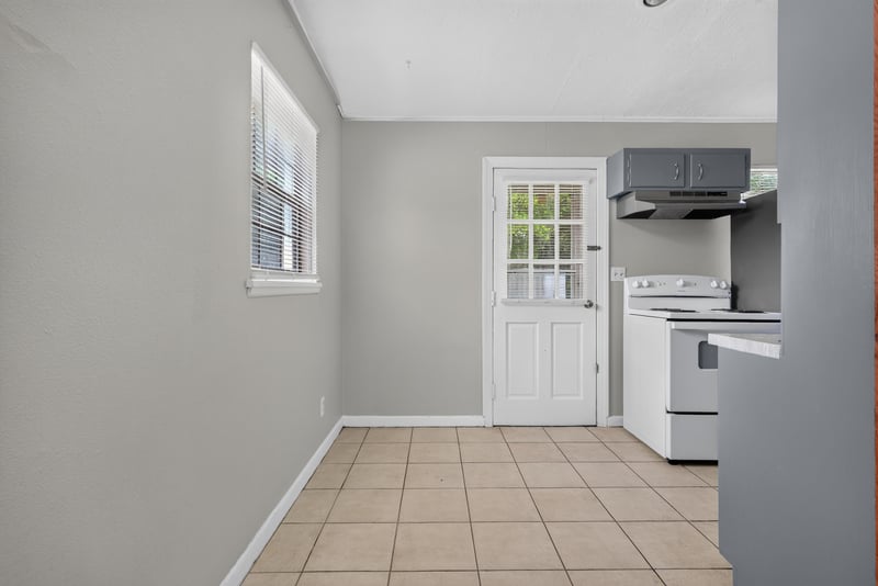 Kitchen with tile floor and white stove at 255 Woodside Dr, Orange Park, FL 32073