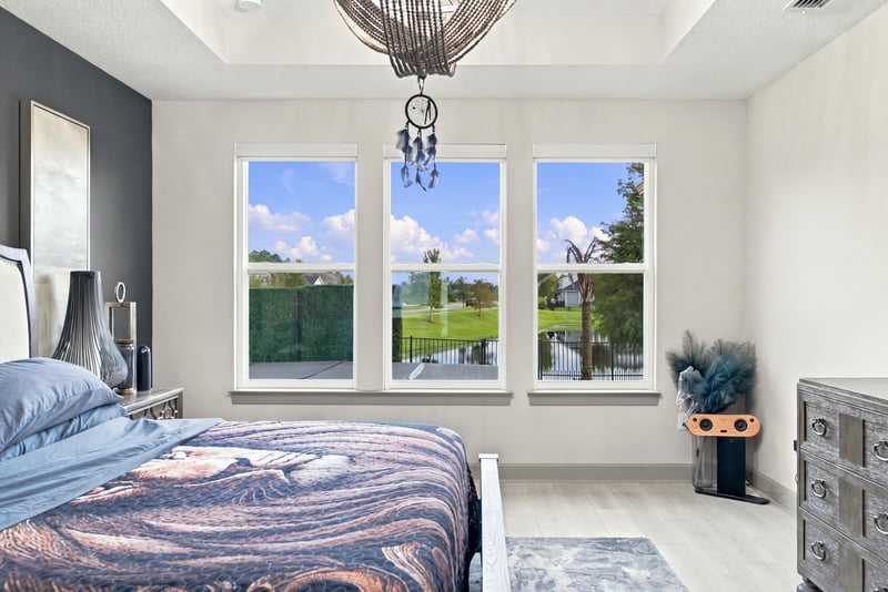 Bedroom with multiple windows and natural light at 3921 Spyglass Hill Ln