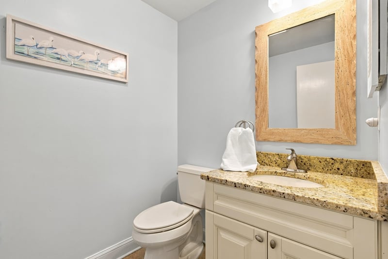 Bathroom with framed art above the toilet at 805 Spinnakers Reach Dr, Ponte Vedra Beach, FL 32082