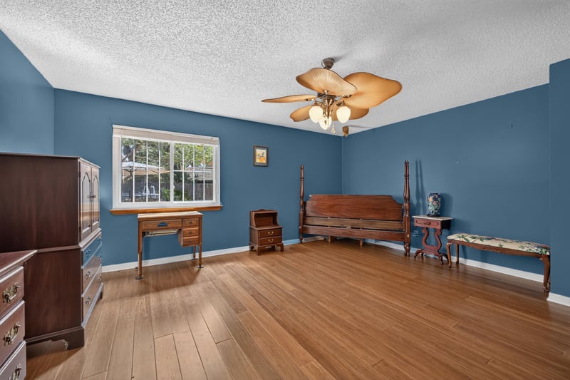 Bedroom with blue walls and window view at 4837 Pareja Ct, Jacksonville, FL 32225