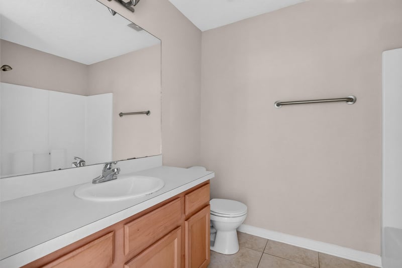 Bathroom vanity and toilet area at 7047 Deer Lodge Cir, Jacksonville