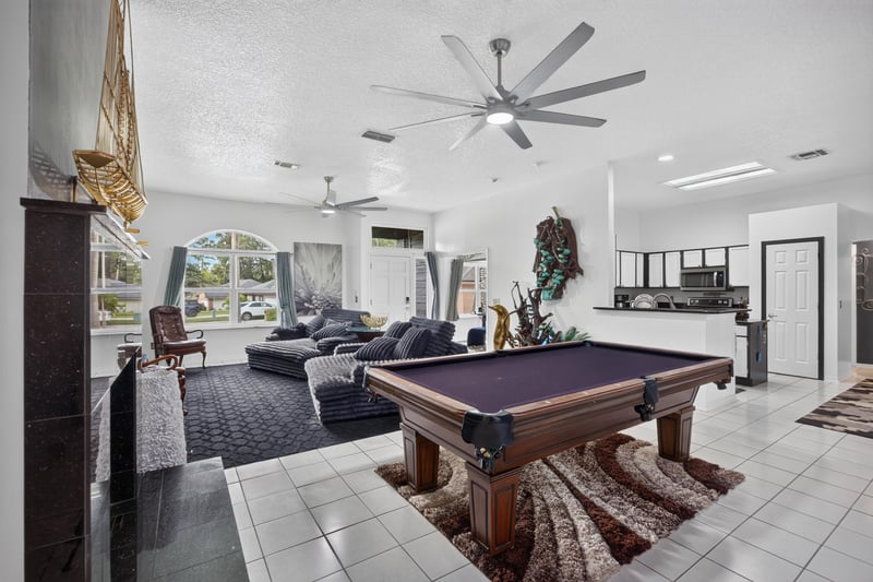 Pool table area adjoining the living room at 1346 Gately Ct, Jacksonville, FL 32225
