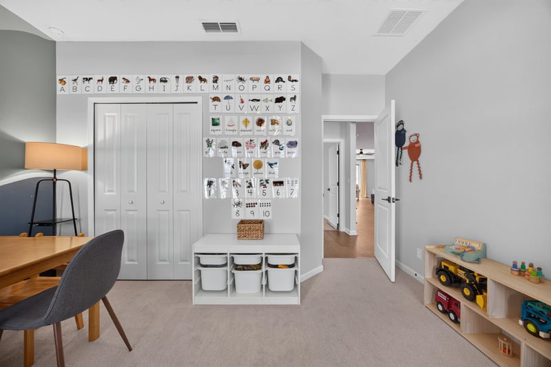 Bedroom with desk and wall storage cubbies at 2354 Jennings Farm Dr, Middleburg, FL 32068