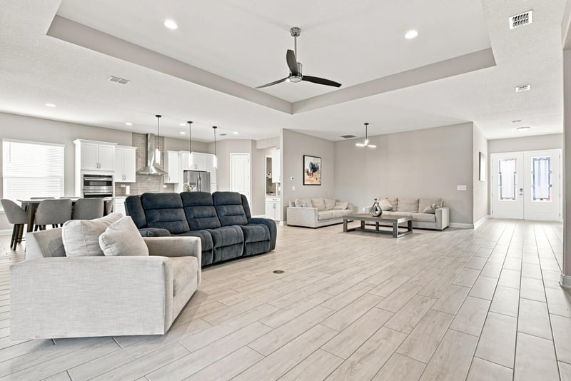 Living and dining area with recliner sofa and open sightlines at 27 Holly Rdg Wy, St. Augustine, FL